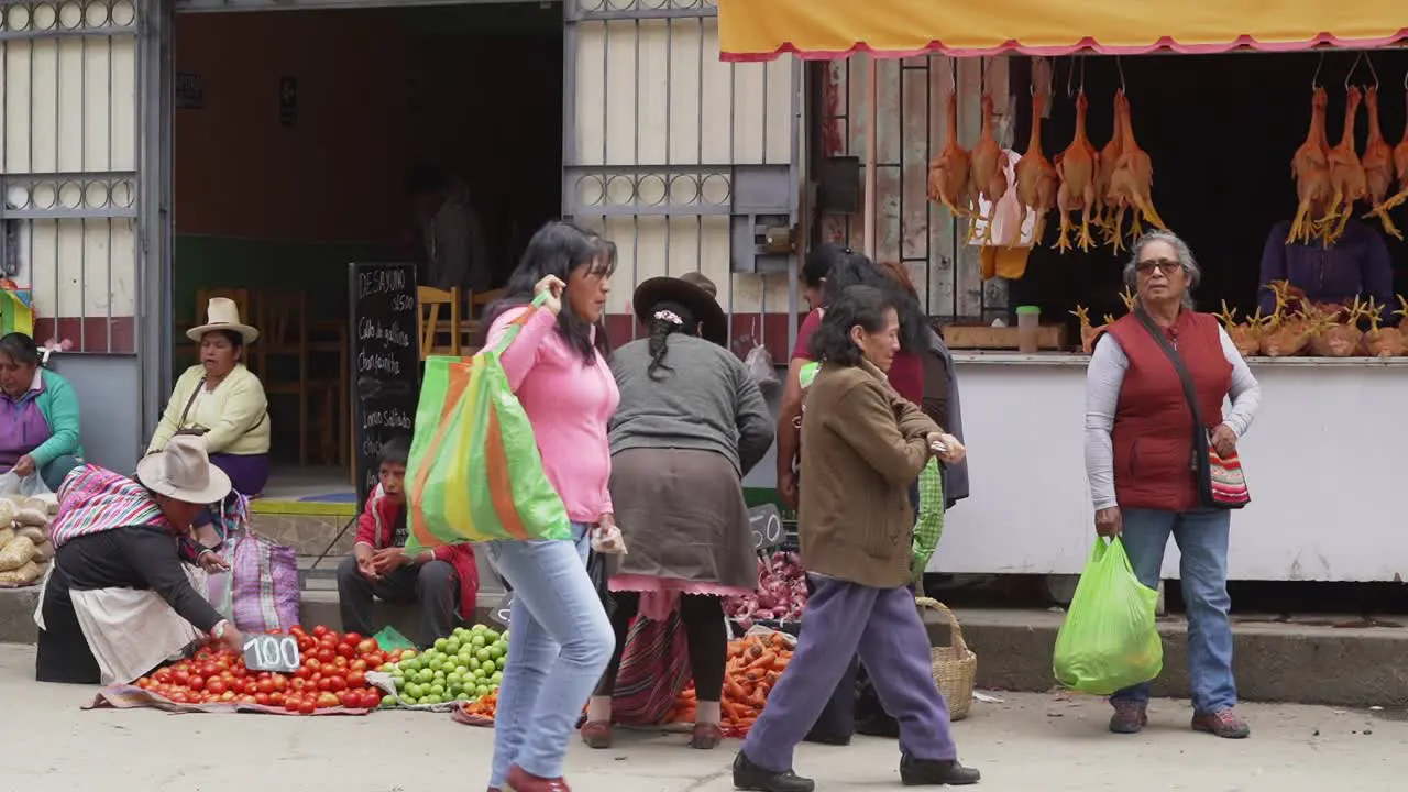 Local Peruvian Women Buying Fresh Vegetables From Street Vendor