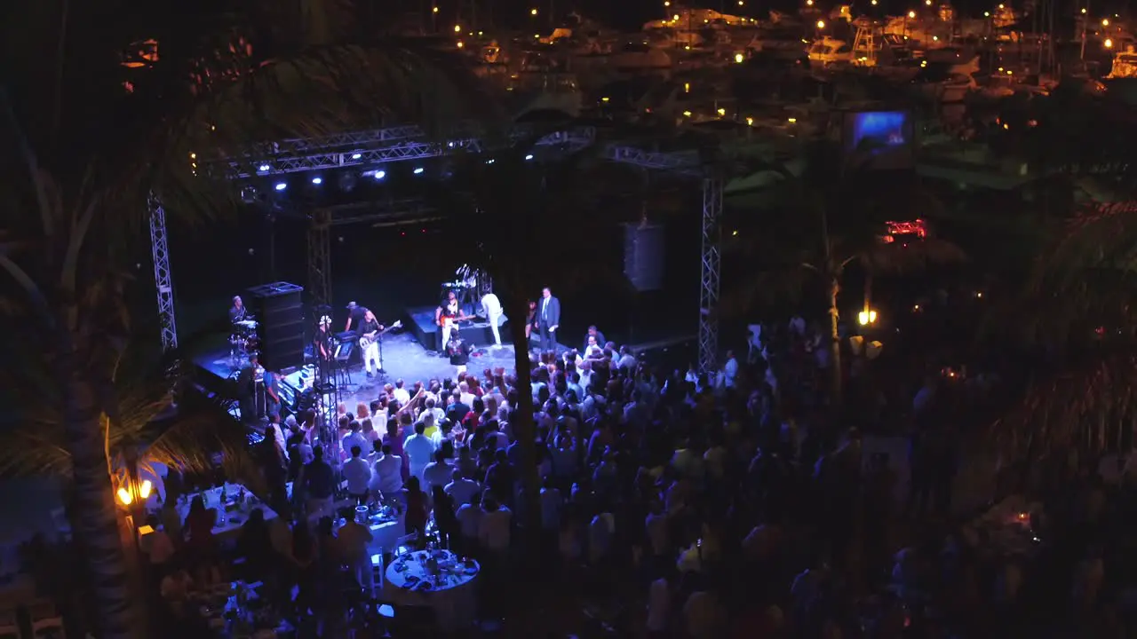 Band playing on stage during night concert at Santo Domingo Club