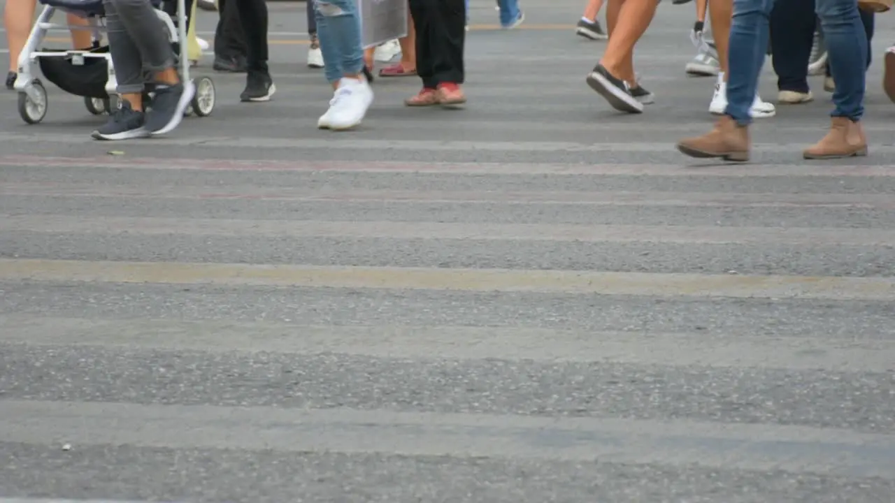 Concept crowd feet with shoes closeup