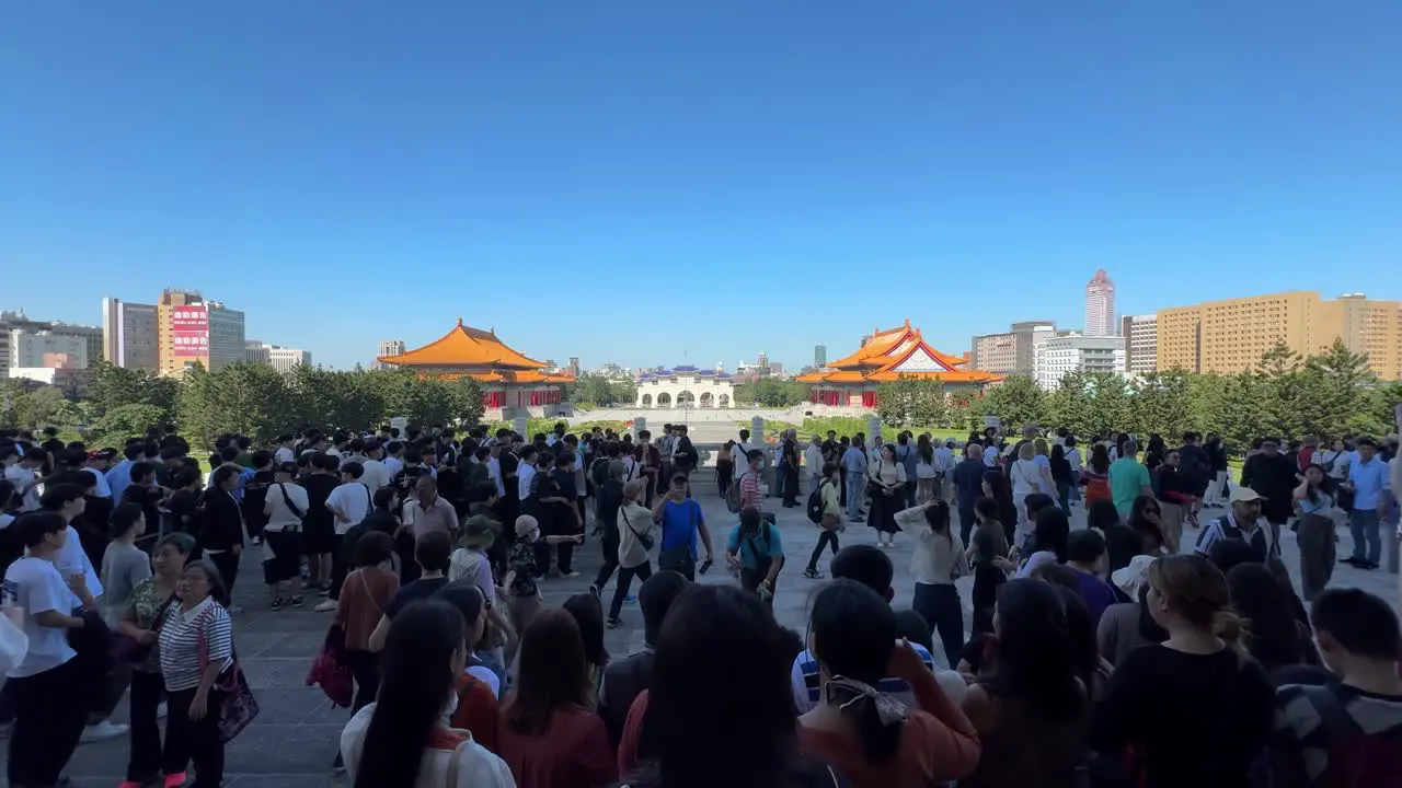 Scene of tourists walking outside the entrance at Chiang Kai-shek Memorial Hall a national monument in Taipei Taiwan