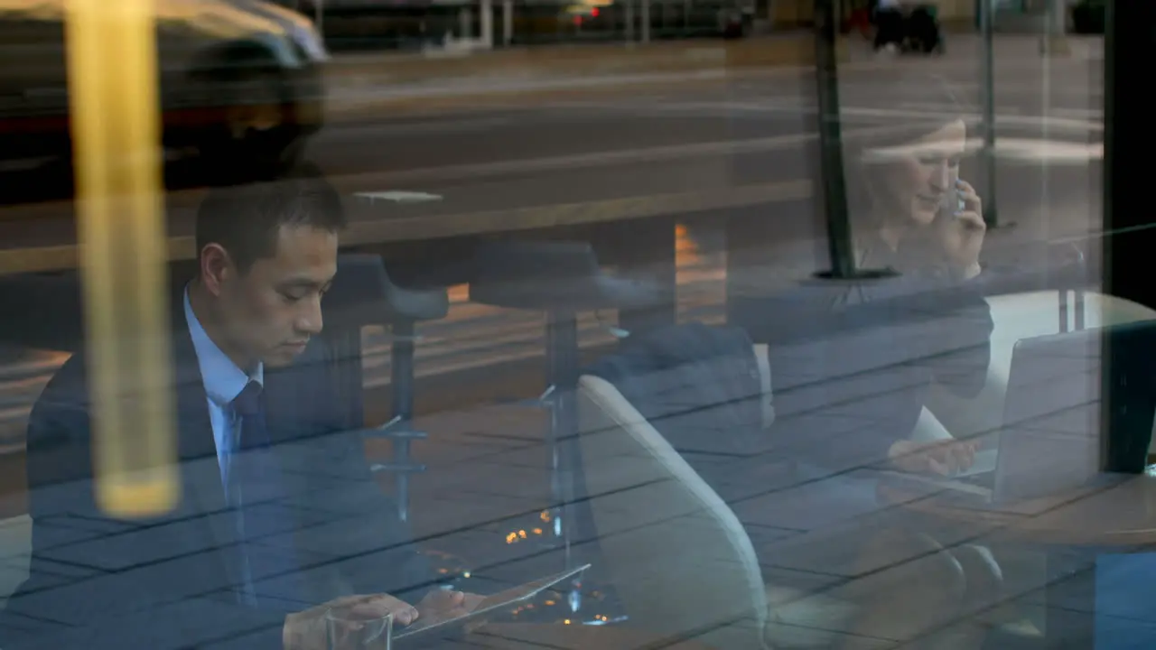 Asian businessman working on digital tablet in a modern hotel 4k