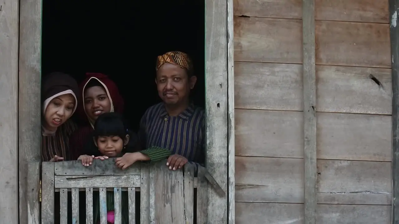 Happy Javanese family with their two children Central Java Indonesia