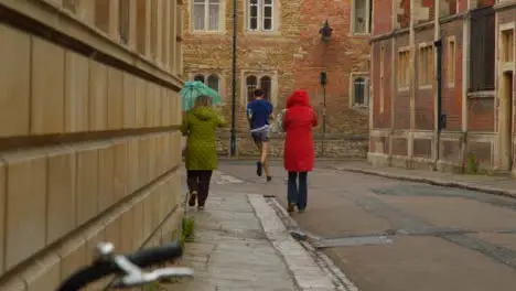 Tracking Shot Following Pedestrians Down a Quaint English Street 