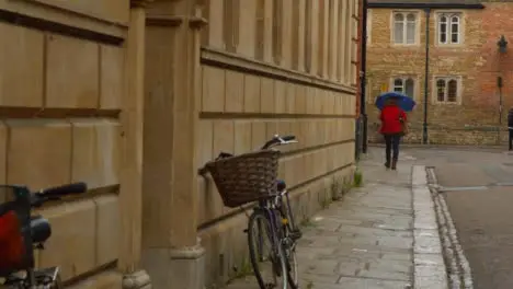 Tracking Shot Following Pedestrian Down a Quaint English Street 