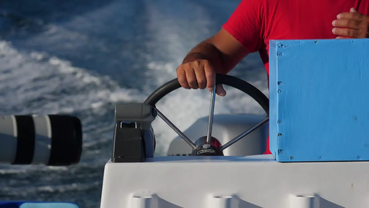 Focus shot Hand holds on a Boat Steering wheel on the river of Adolfo Lopez Mateos Baja California sur Mexico