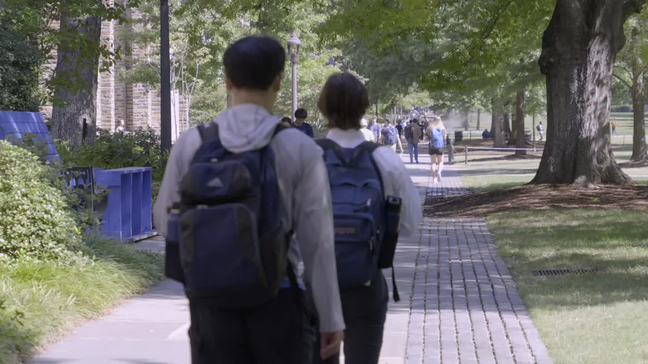 Students walk through Duke University's busy campus in the fall