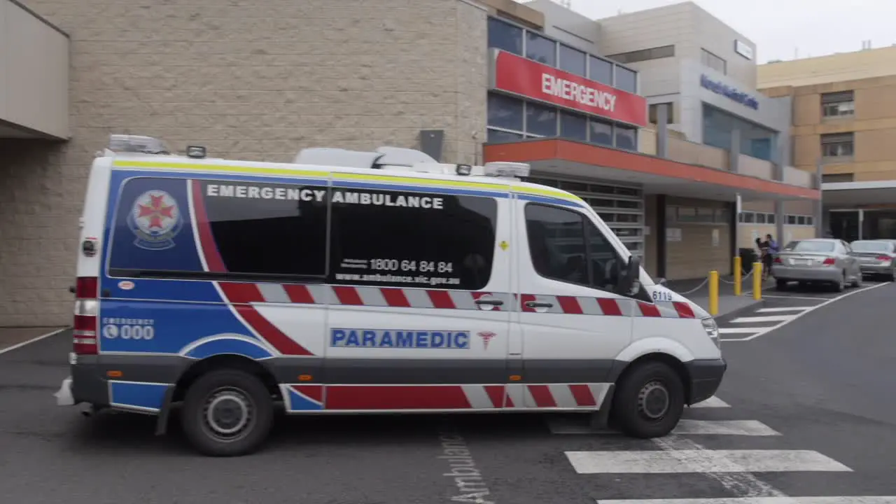 Ambulance at hospital exits with paramedics