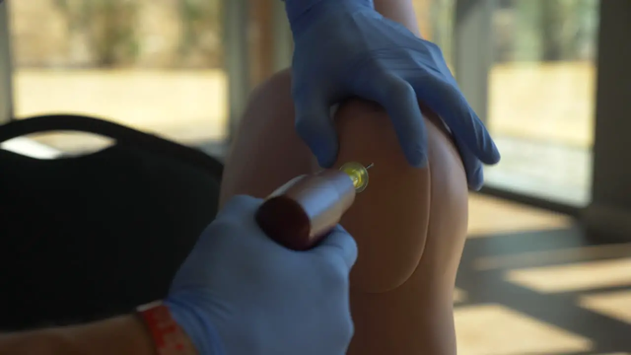 Medical technician practices medical treatment on a human mannequin