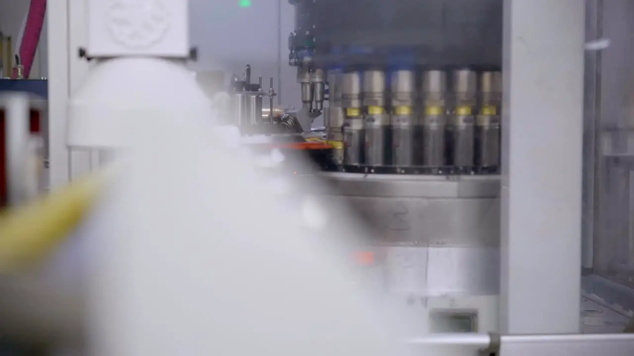 Slow motion of assembly line of caps row