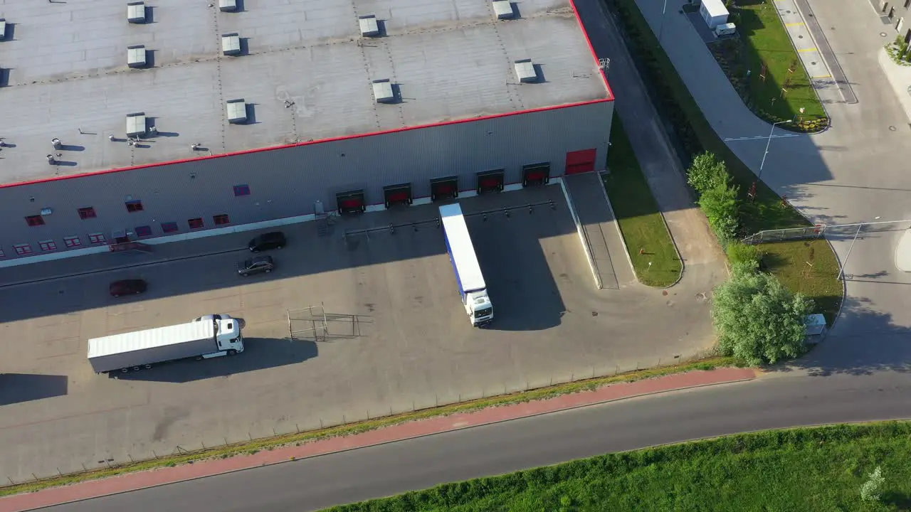 Aerial view of warehouse with trucks