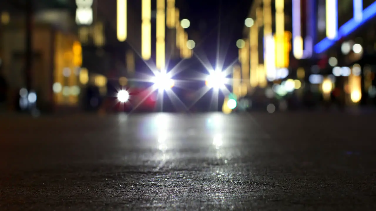 Bokeh of car lights on street at night 4k