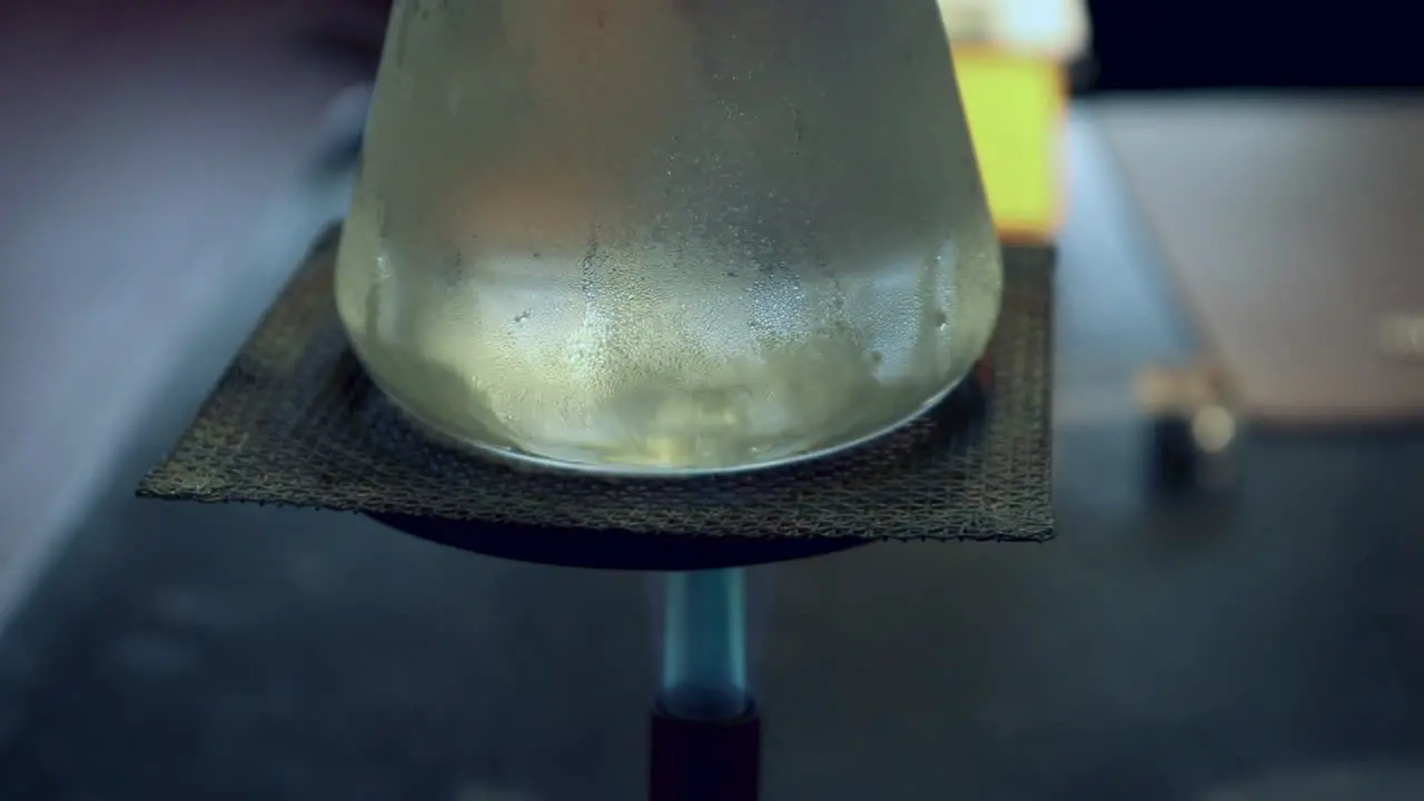 Close up of Condensation on the outside of an Erlenmyer Flask that is being heated by a bunsen burner