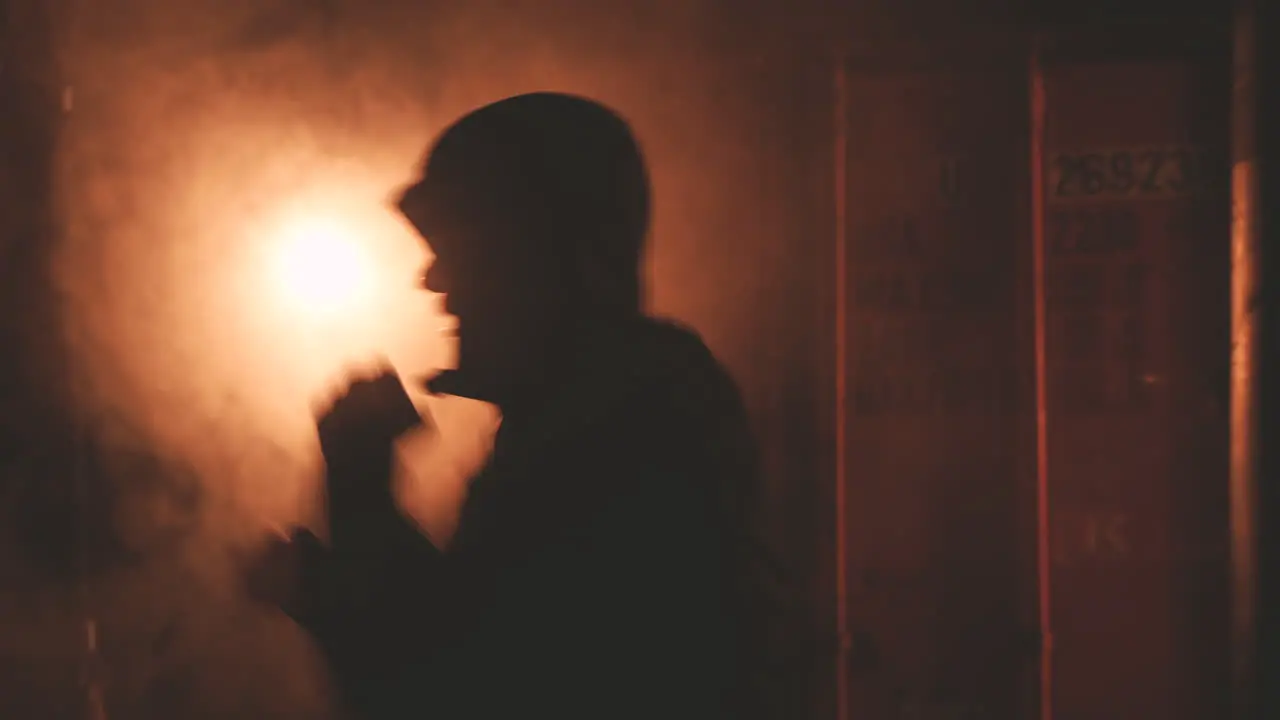 Boxer In Hoodie Warms Up By Punching The Air