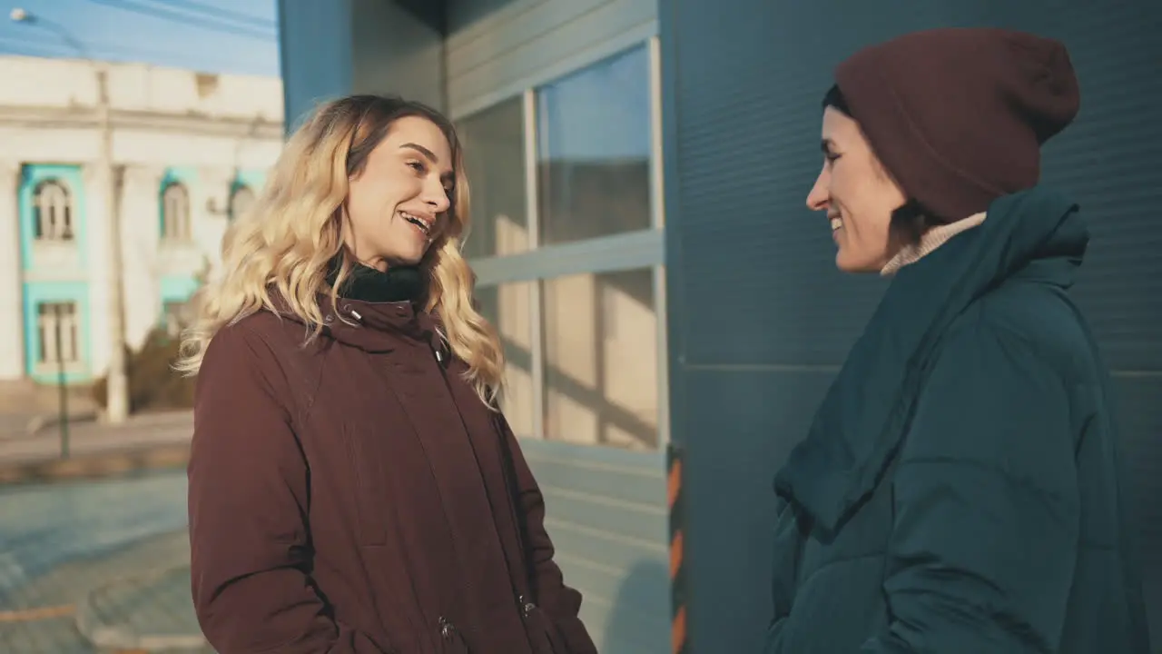 Female Friends Talking And Laughing In The City