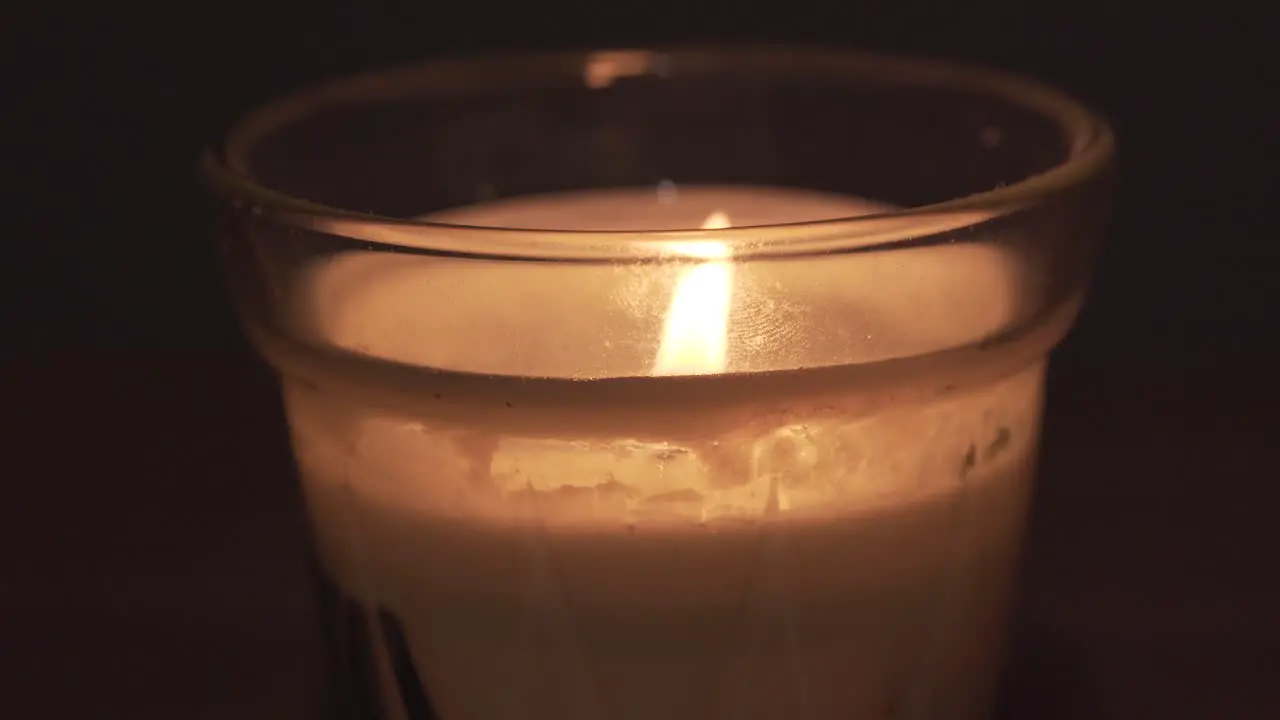 Close view of white cream candle wax in glass recipient