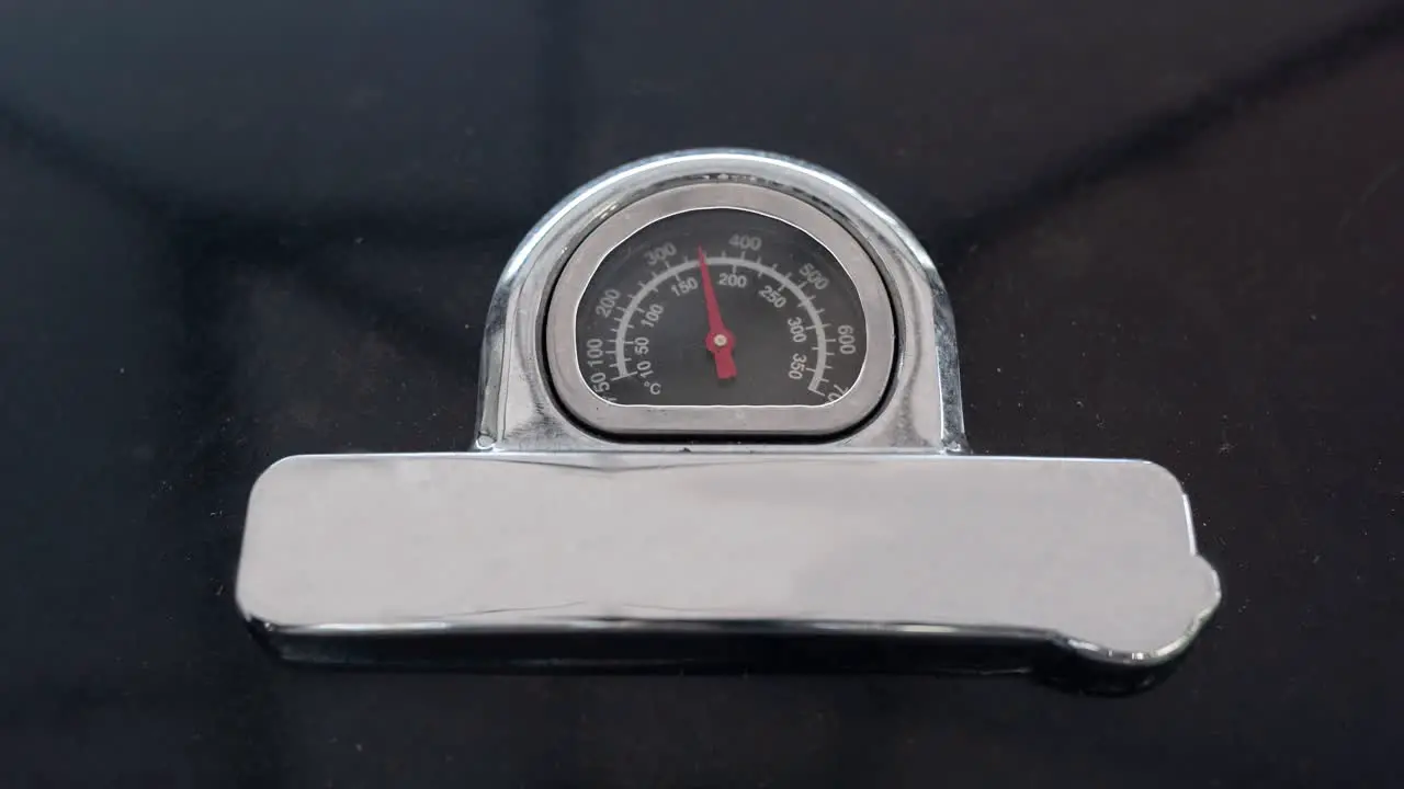 A timelapse showing the temperature of a gas barbecue incresing in temperature starting low and going up