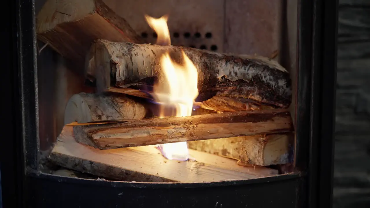 Birch wood starts burning inside wood stove during electricity blackout