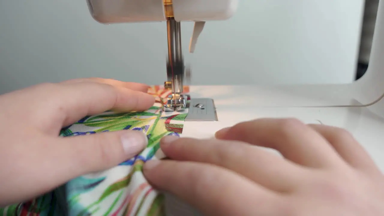 Woman using a sewing machine 4K