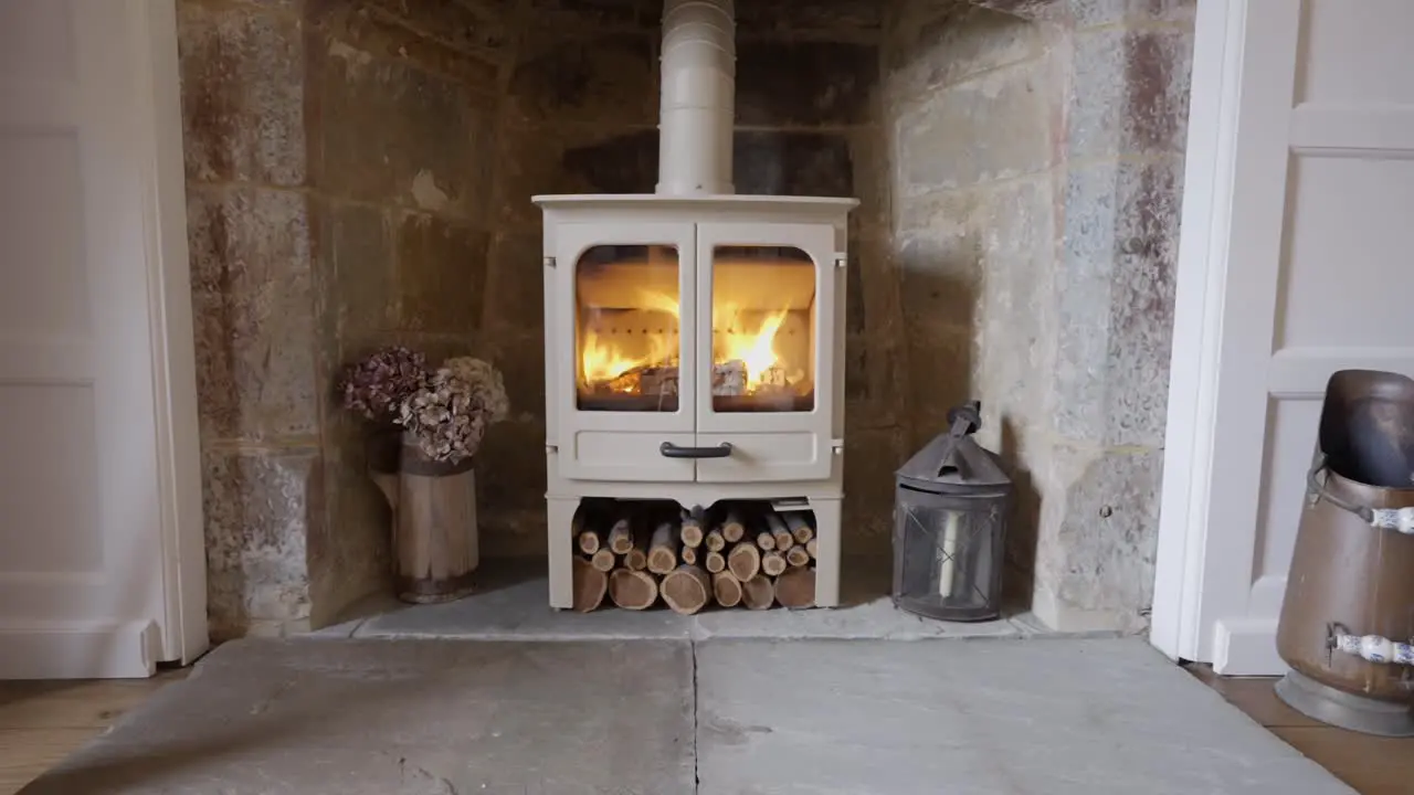 Fast motion fire in stove of stone fireplace