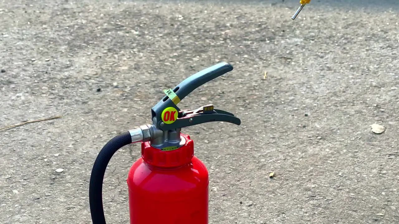 Unsealing a fire extinguisher close up shot