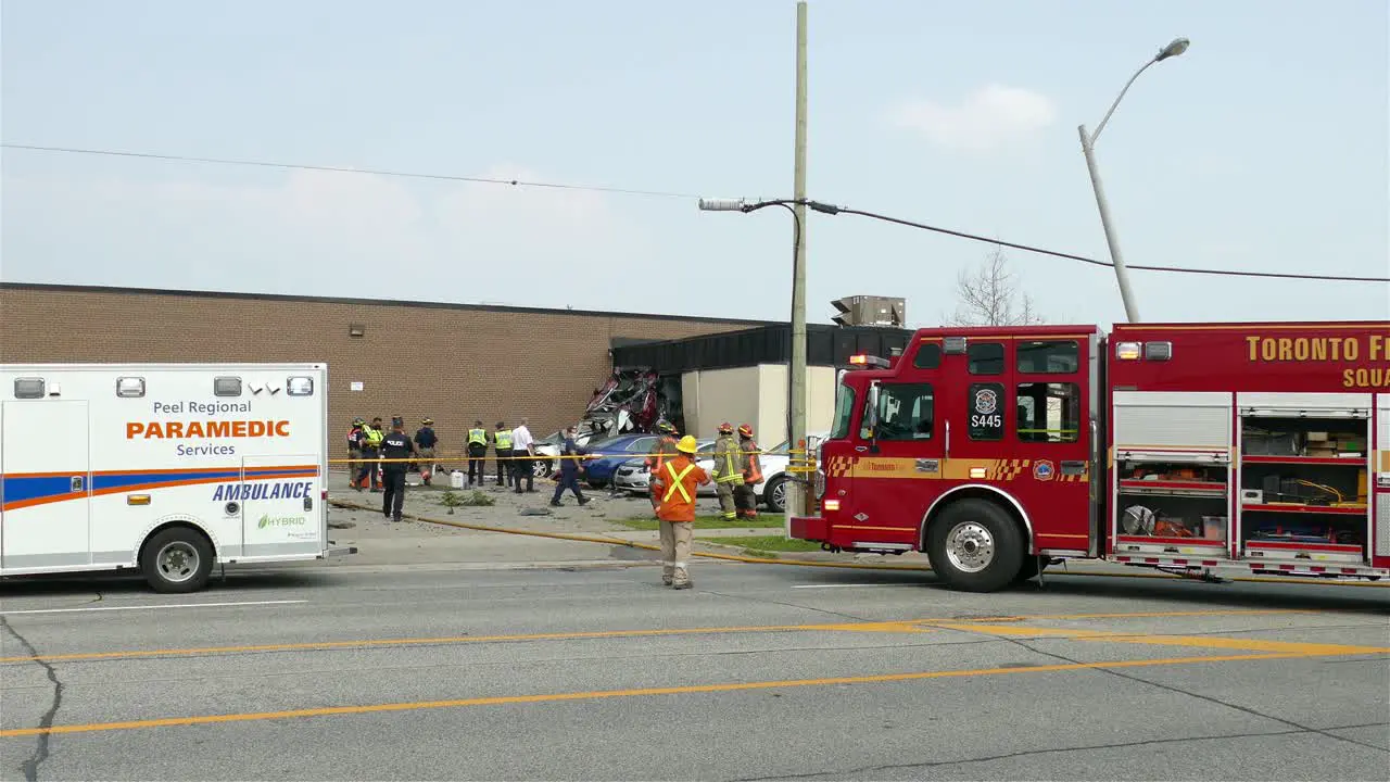 Fire fighting medic emergency services at Toronto car accident scene