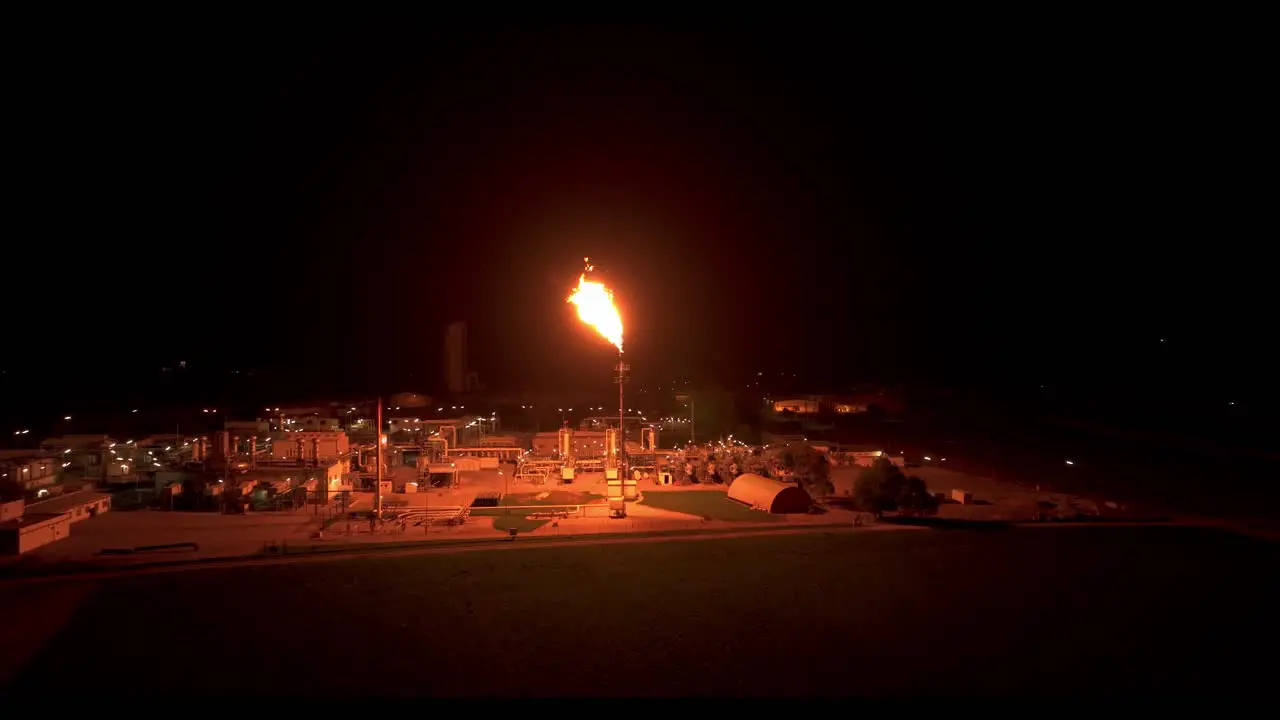 The Surrounding Area is Illuminated by the Radiant Light Emitted from Gas Flaring Aerial Panning