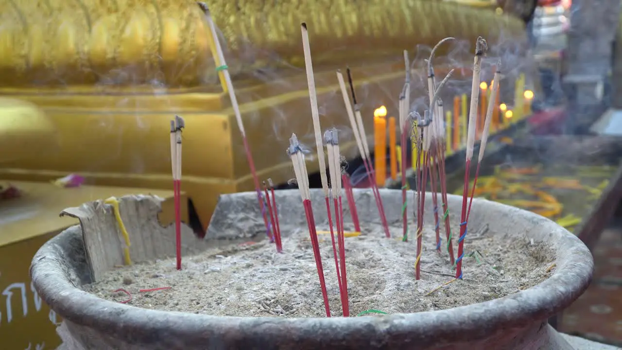 Burning incense in a temple in Chiang Mai thailand