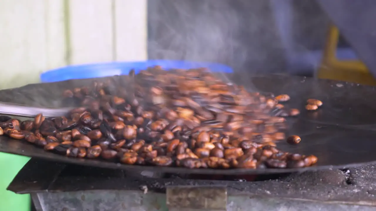 Bunna seller is roasting the Coffee beans in her small traditional shop in Addis Ababa in Ethiopia