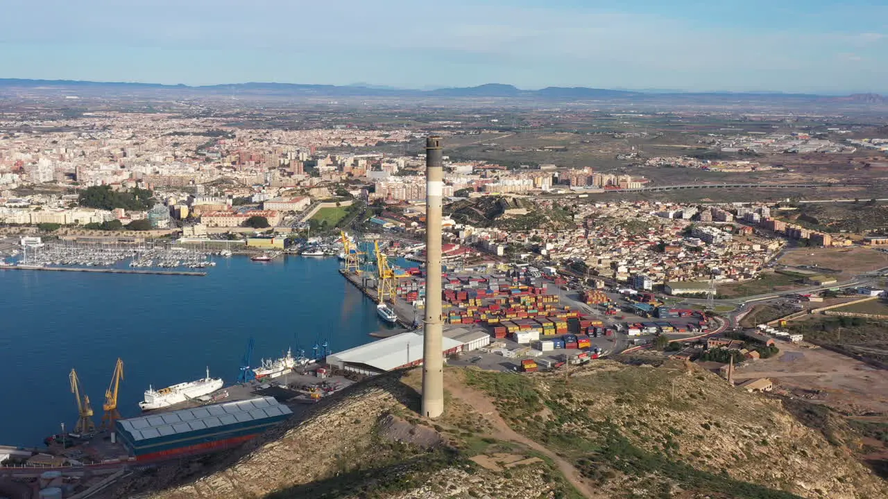 chimney aerial shot Cartagena Spain sunny day industrial area mediterranean sea