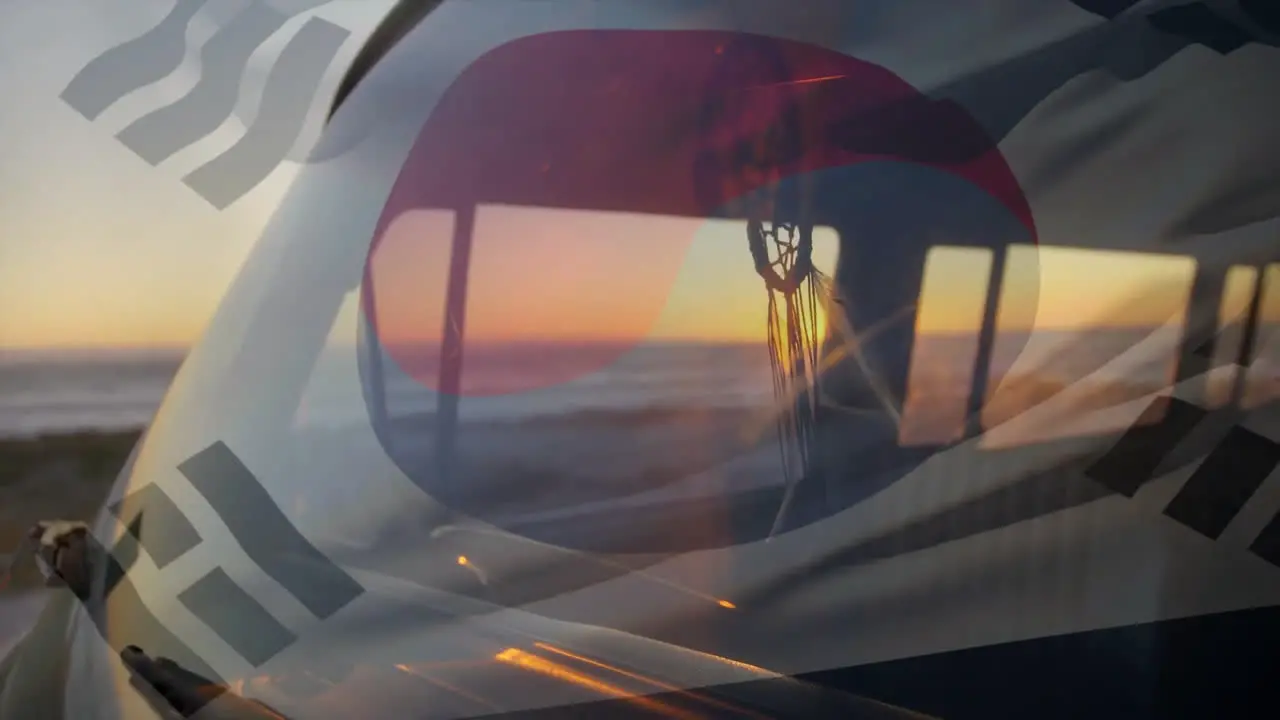 Animation of flag of korea over campervan at sunset beach