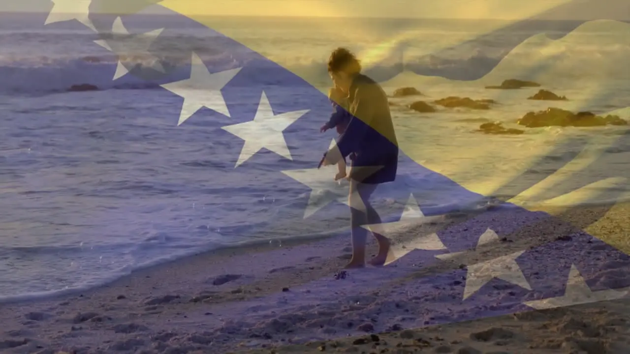 Animation of bosnian flag over caucasian mother and child walking on beach