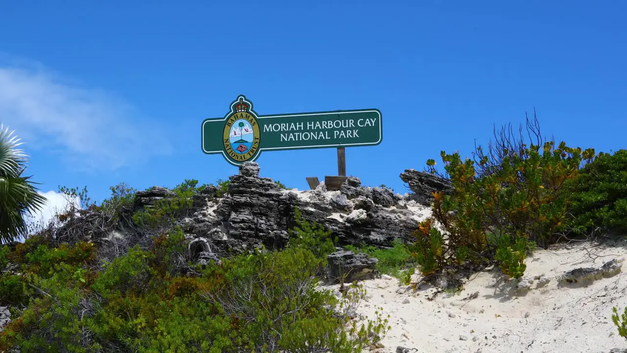 This is a static shot of the sign for the Moriah Harbour Cay National Park sign