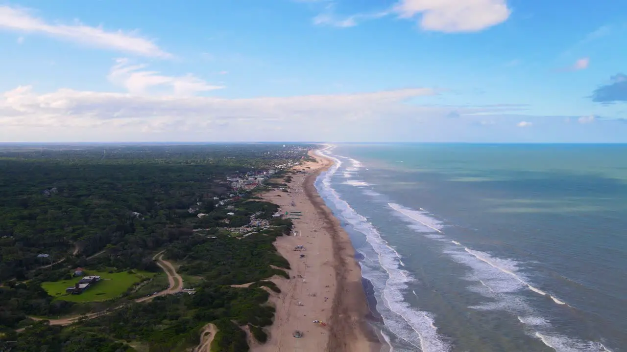 Drone shot flying along the beach in Cariló Argentina