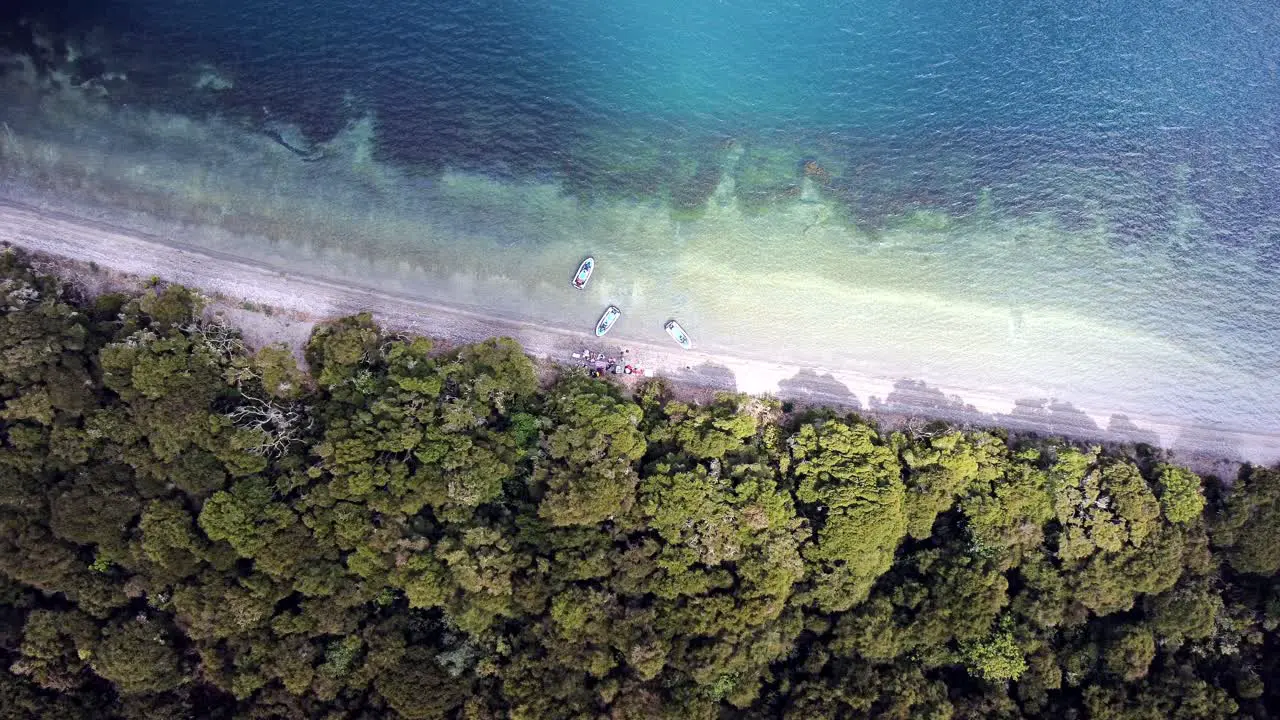 Traveler on a remote beach drone shot