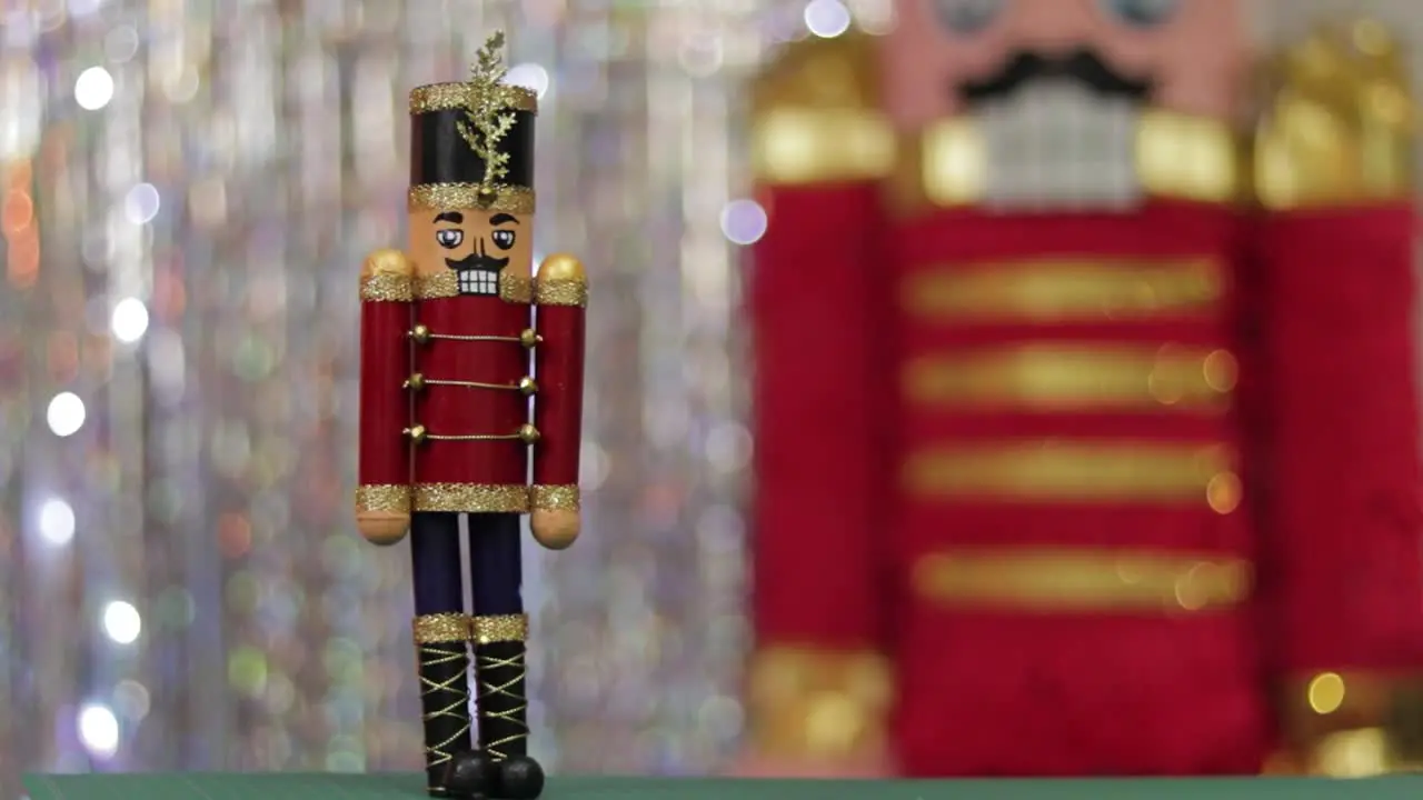 Christmas toy soldier nutcracker same huge figurine in background