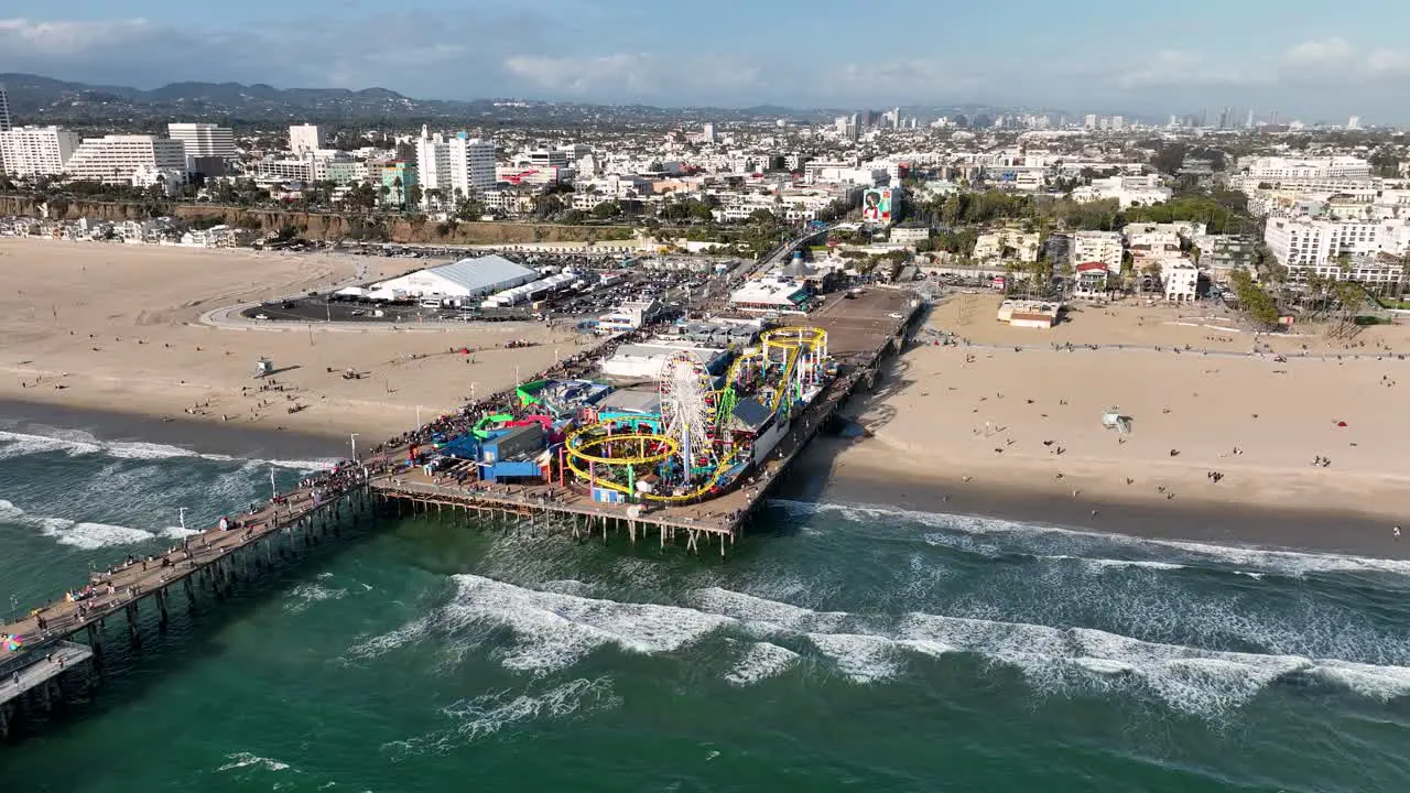 up to down view of Pacific Park on the Santa Monica Pier CA town and horizon on the background