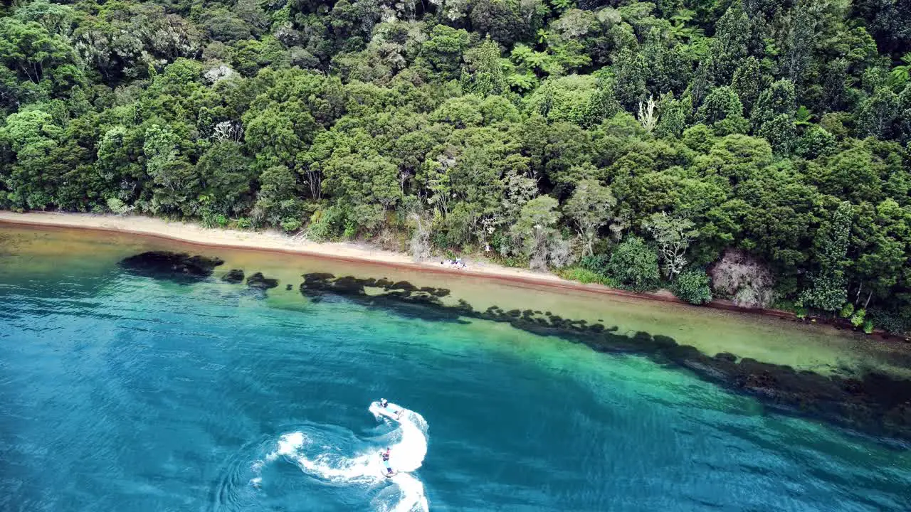 Tourist with jet ski on a remote beach drone shot