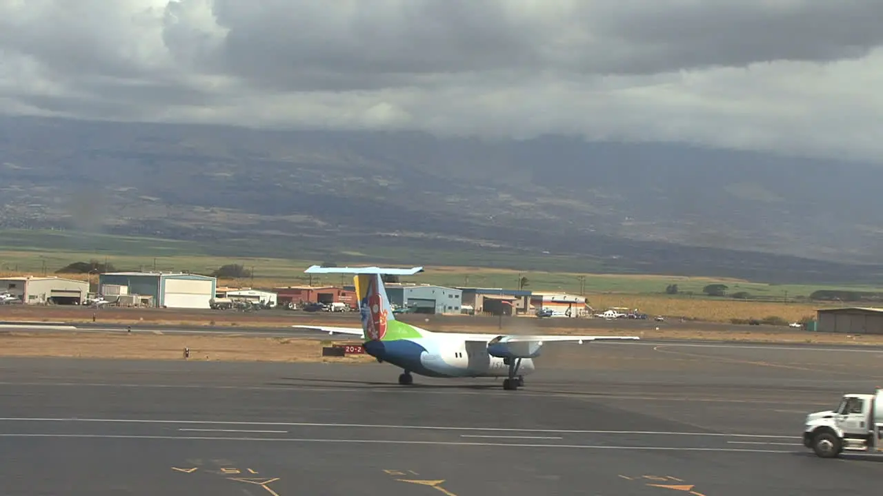 Maui plane taxis and truck goes by 2