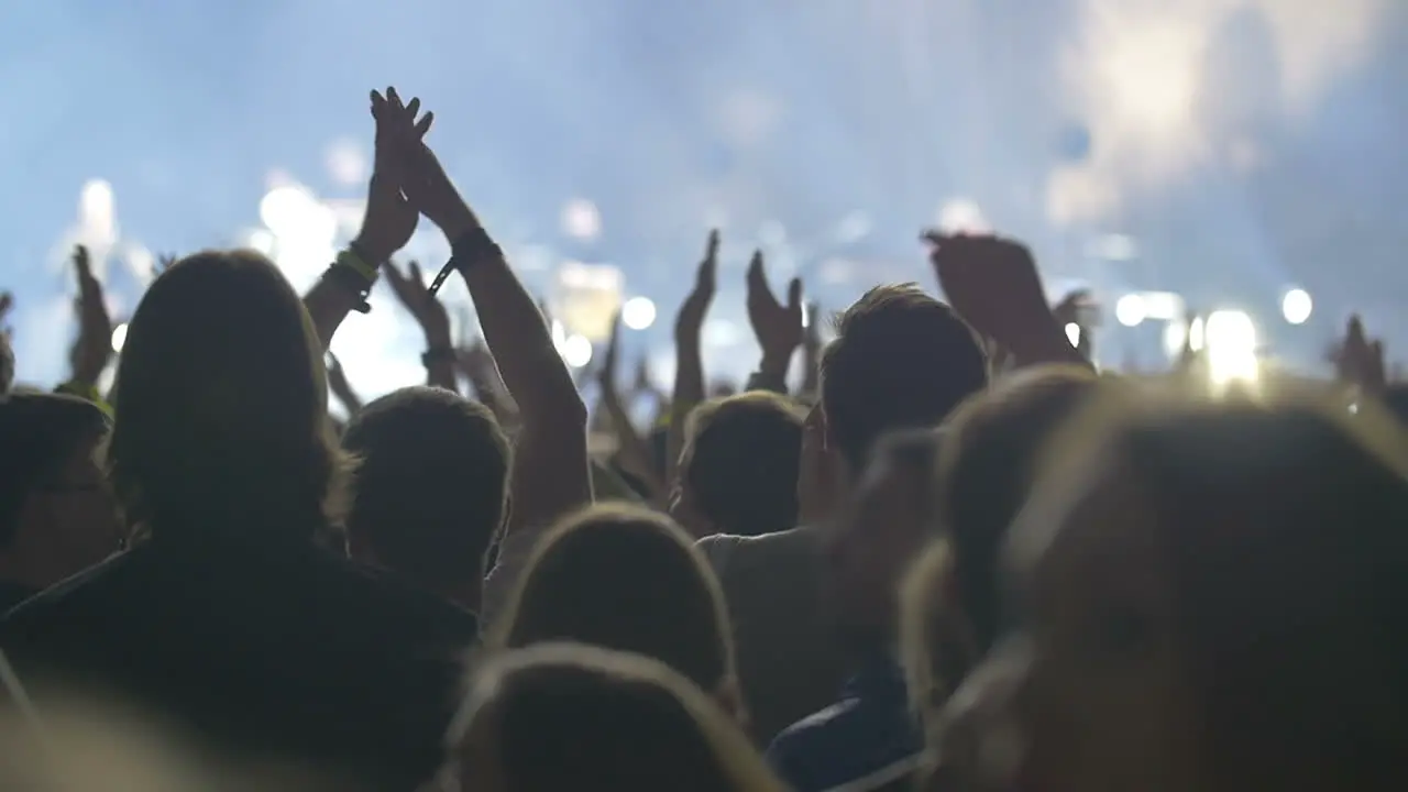 People claping hands on the grand pop concert