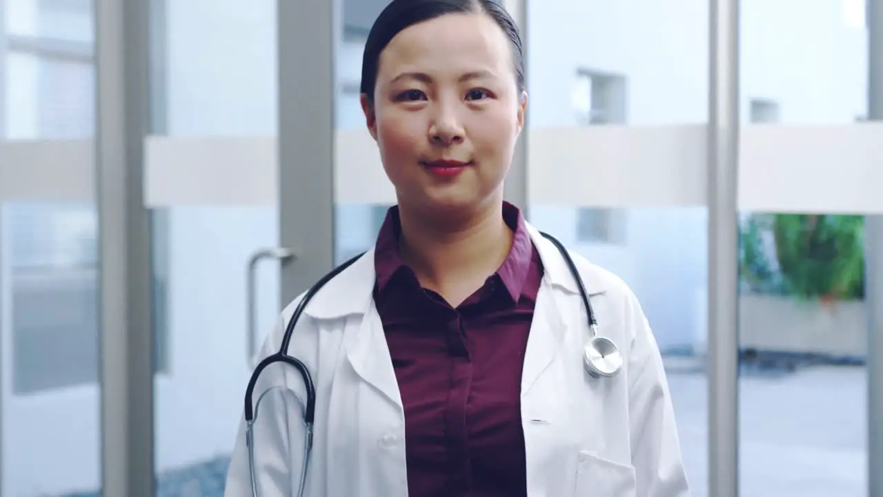 Young female doctor smiling to camera 4k