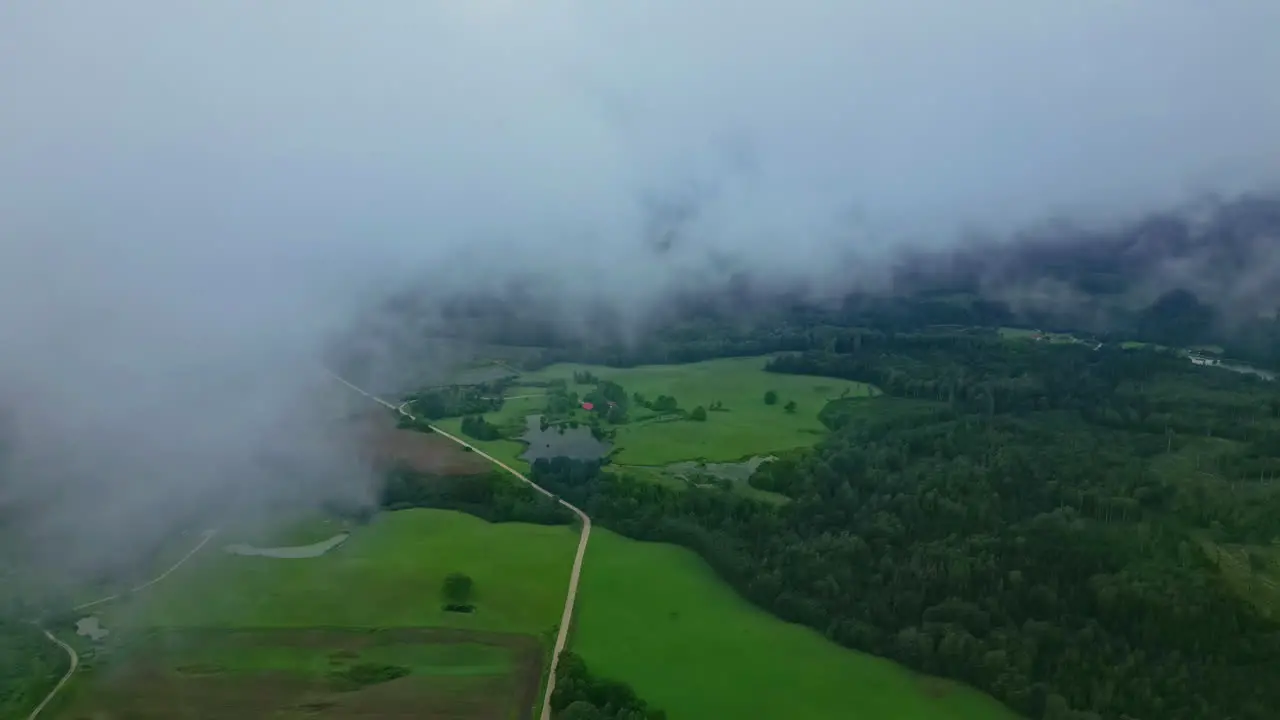 Drone View of Rolling Clouds over Lush Countryside