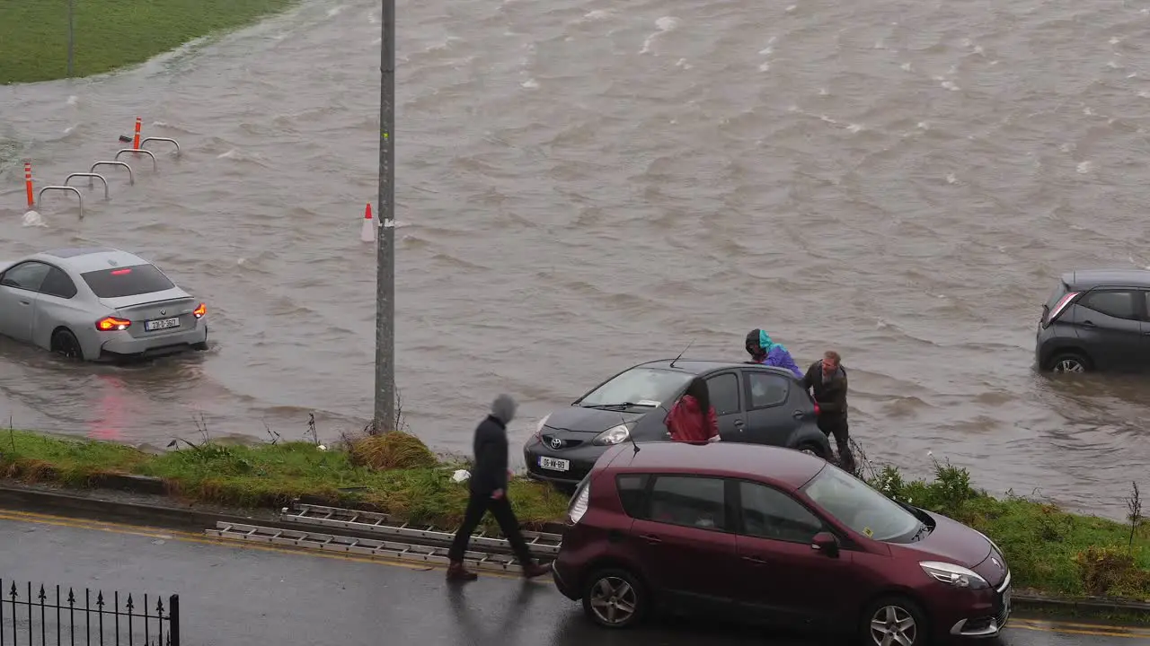 Chaotic scene at flooded car park