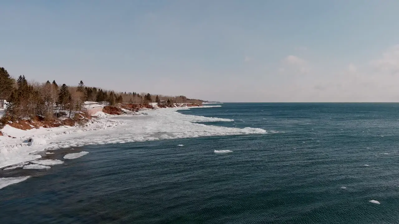 Frozen Coast And Calm Ocean Waters Of Duluth Minnesota in Winter aerial shot