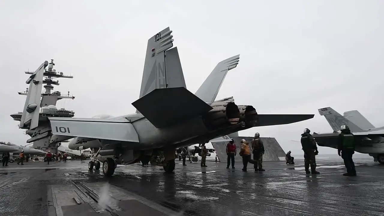 Us Navy Sailors Conduct Fighter Jet Flight Operations On The Flight Deck Of The Aircraft Carrier Uss Theodore Roosevelt (Cvn 71)