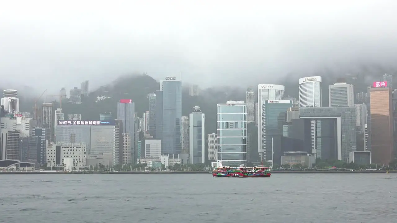 Star Ferry Sailing in Victoria Harbour in Foggy Morning Hong Kong