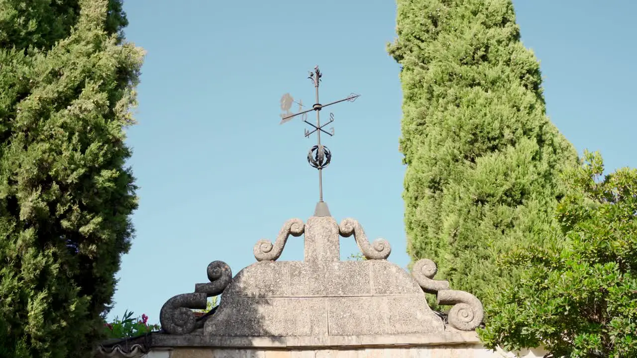 Old wind vane in rustic traditional building