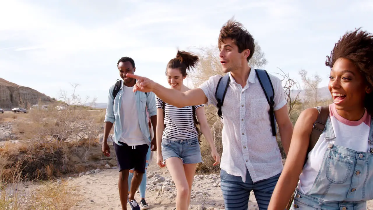 Excited adult friends exploring in Palm Springs close up