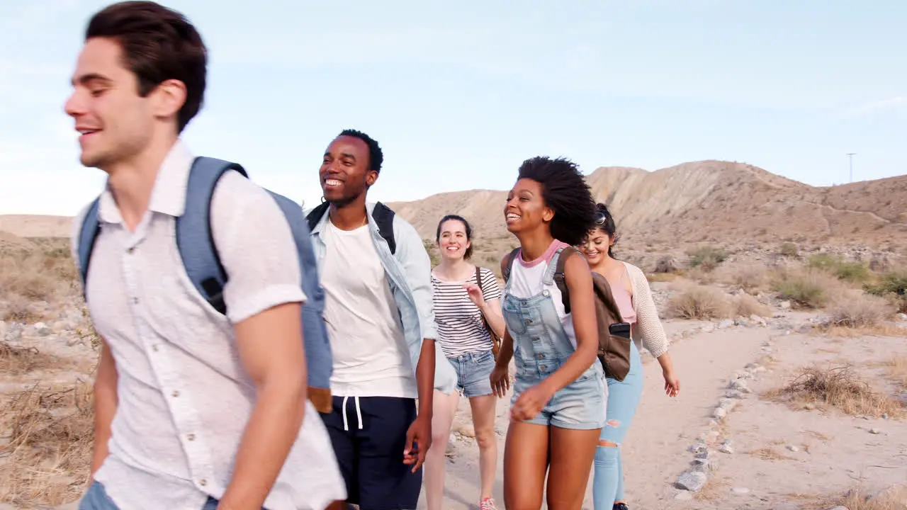 Young adult friends hiking in Palm Springs desert close up