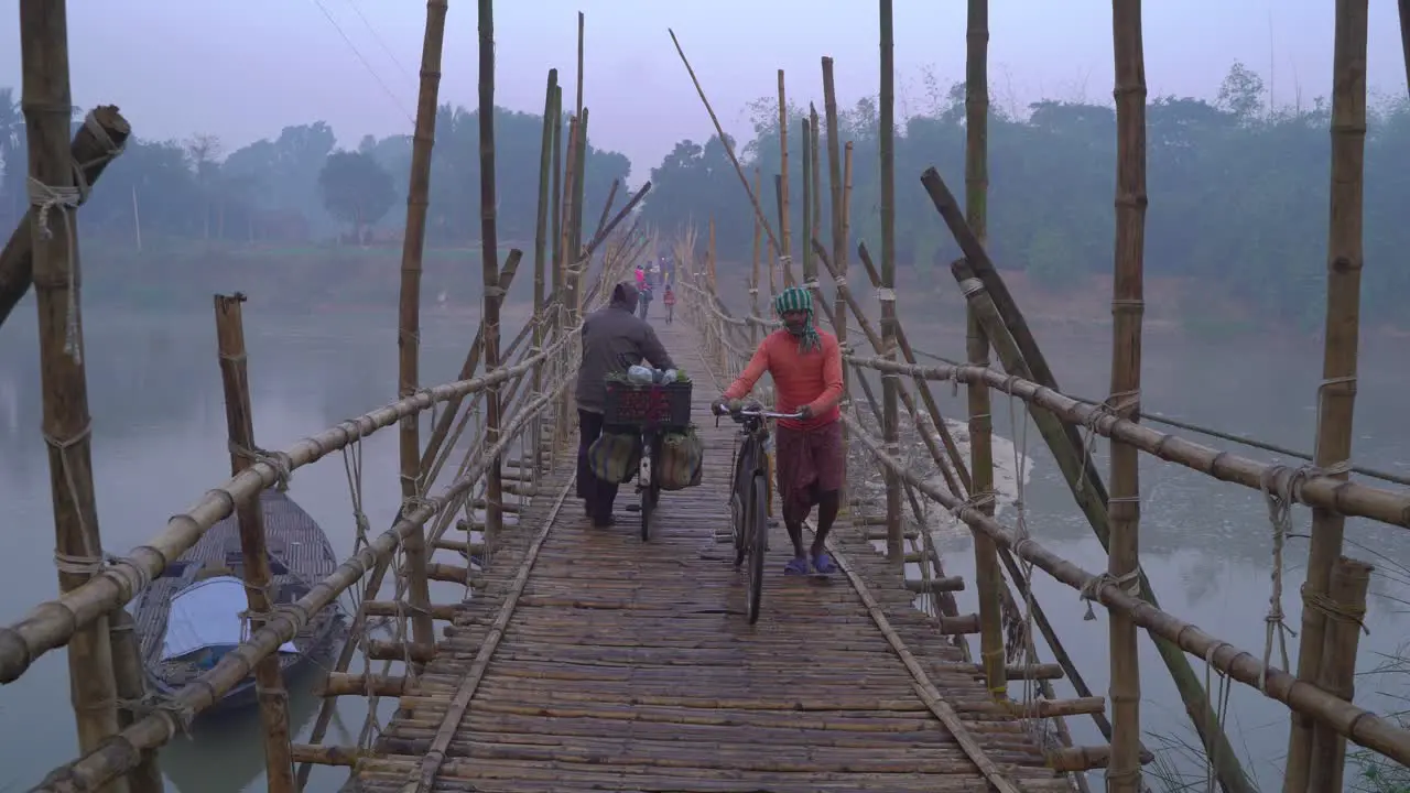 In winter a bamboo bridge is constructed on the river due to the water shortage and the people of the upper and over the road pass through it