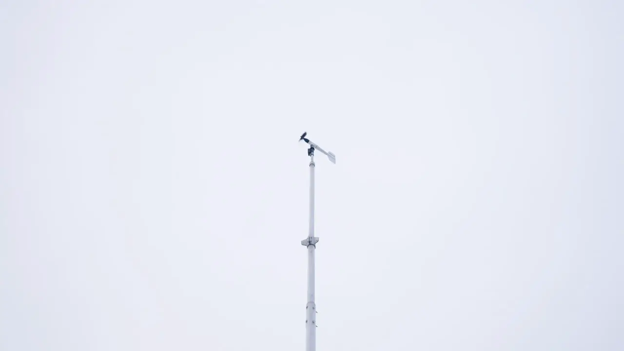 Wind Vane Blown By Wind Against Dramatic Sky